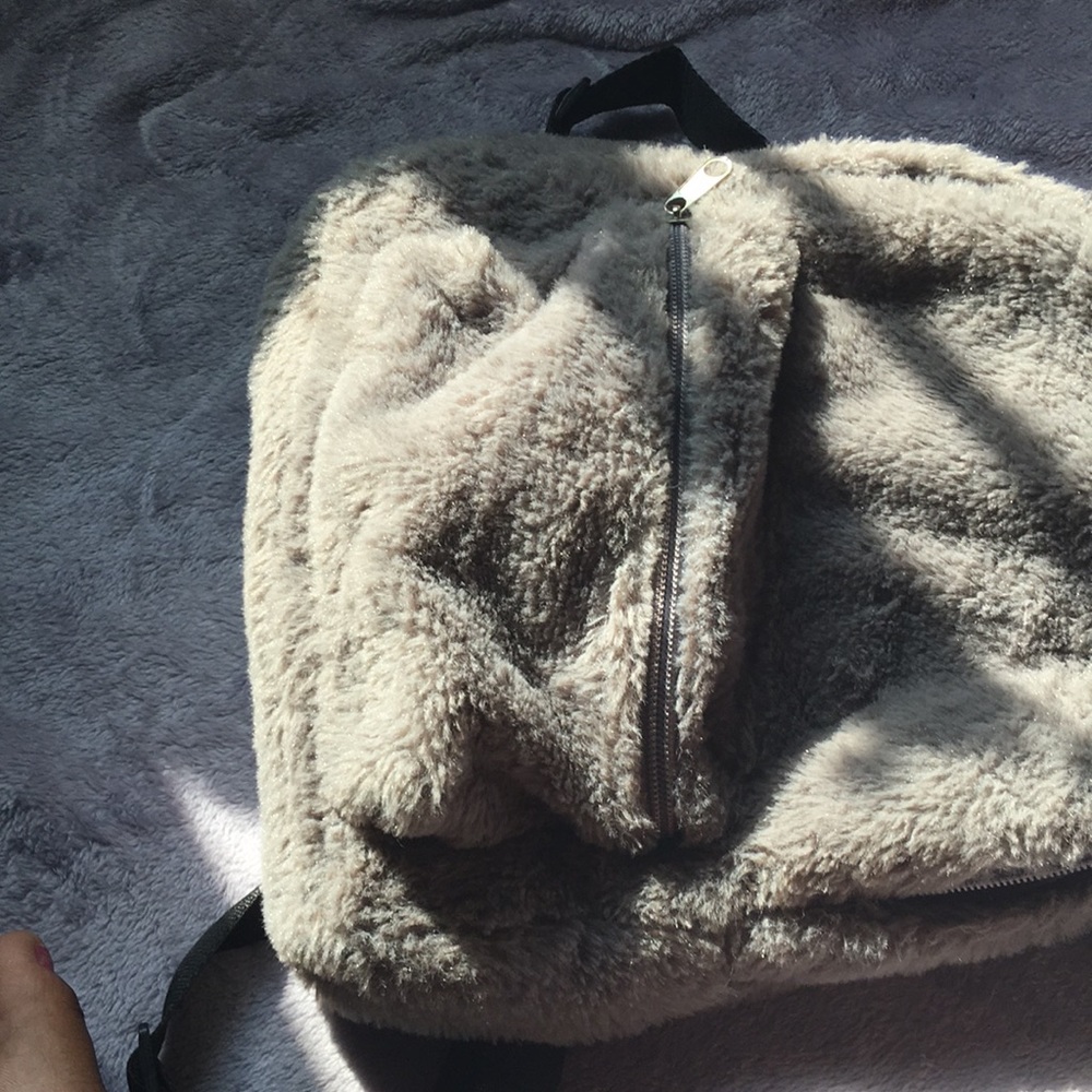 A Faux Fur Mini Backpack